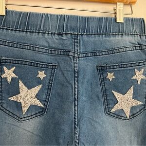 Ladies ripped jeans 30w x 39L. Glitter star rear pockets Draw String waist NWOT